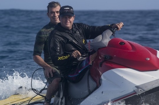 Big-wave rescue driver Abe picking Andrew up on a jet ski at Cloudbreak