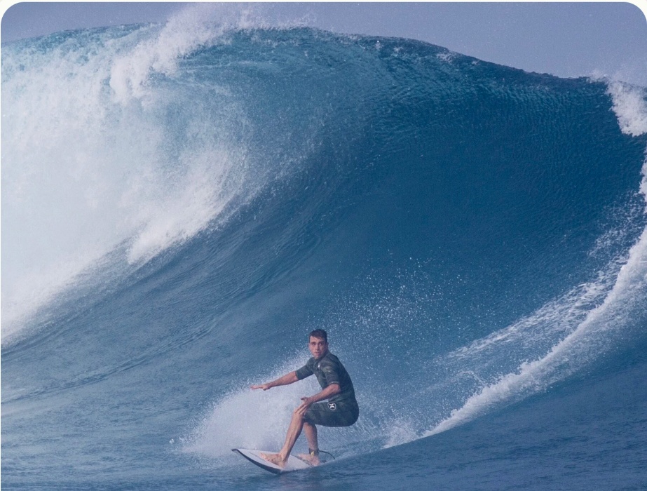 Andrew Howard surfing a roughly twenty-foot wave at Cloudbreak in Fiji