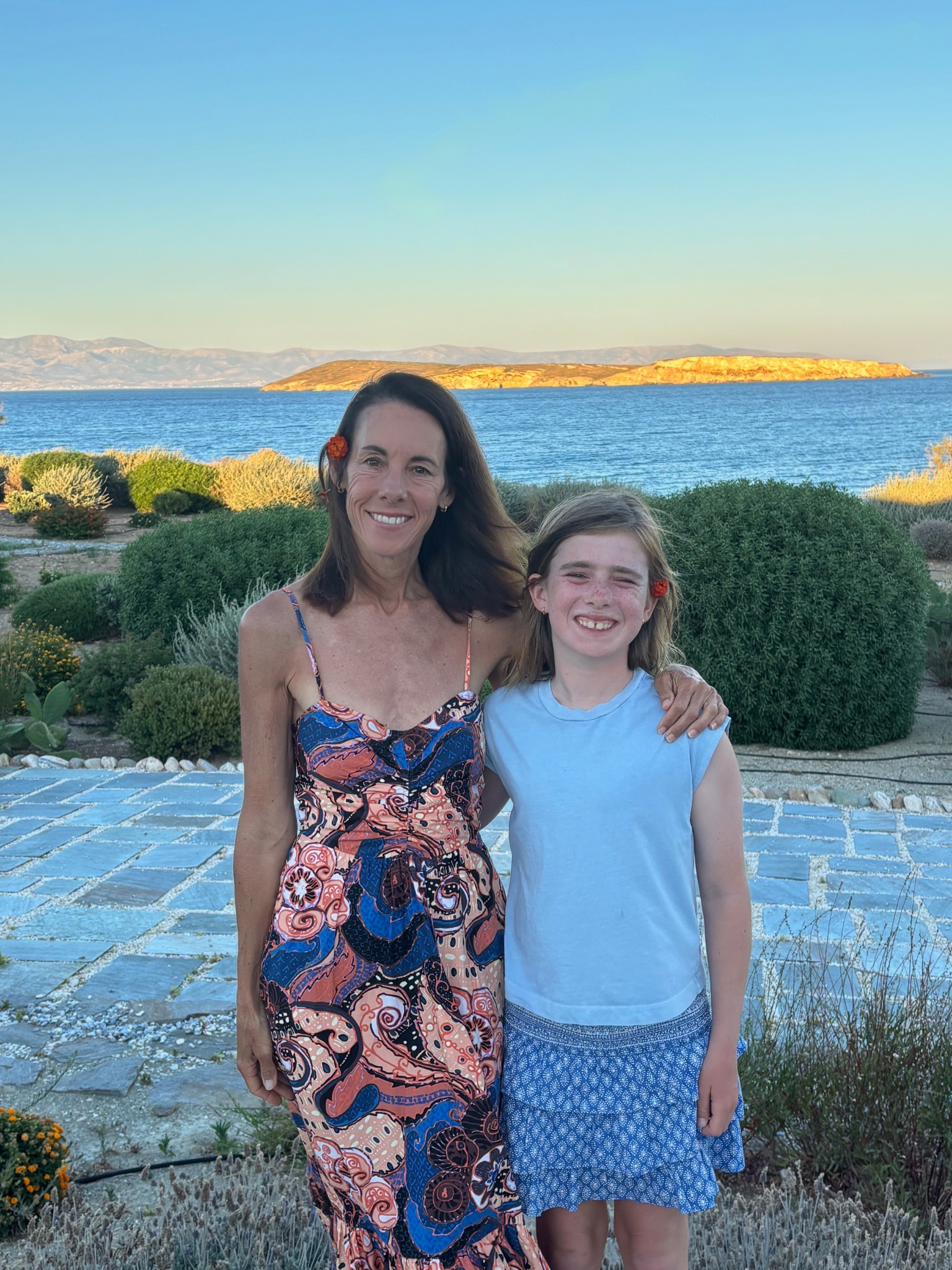 Sara and Elliot together beside the sea in Greece during the summer